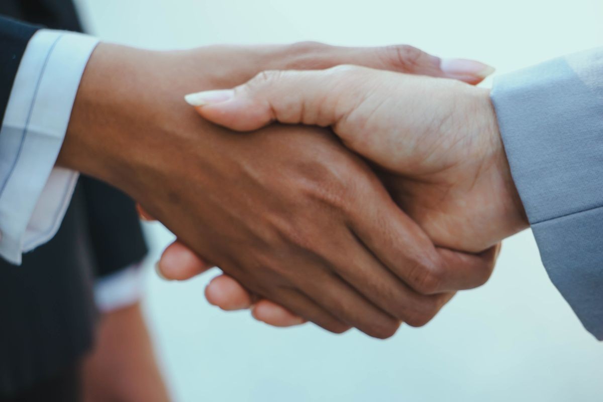 Businessman or Businesswoman shaking hands after good deal. Greeting partner, making good first impression. Cooperation, concept Businessman or Businesswoman shaking hands after good deal. Greeting partner, making good first impression. Cooperation, concept